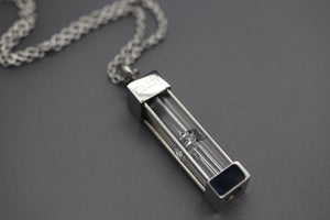 a necklace with a lighter on a chain