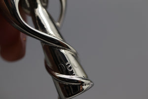 a close up of a person holding a pair of scissors