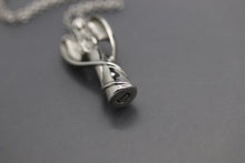 a silver necklace with a lighter on it