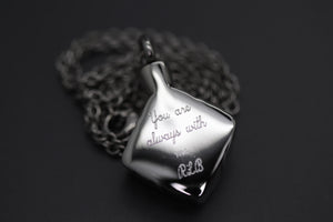 a silver necklace with a message on it