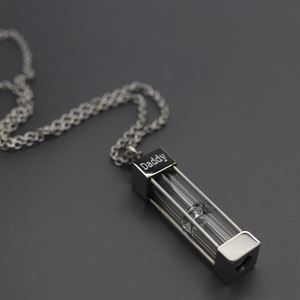 a necklace with a lighter on a chain